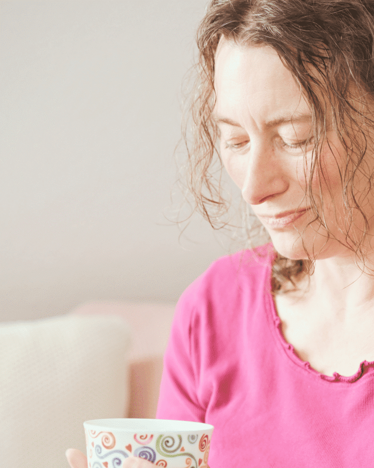 Sandra Quedenbaum, Coach for High Sensitivity and Trauma, with a cup in her hand